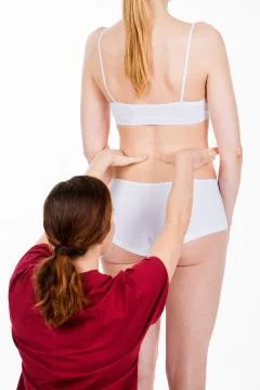 Physiotherapist doing back evaluation Stock Photos