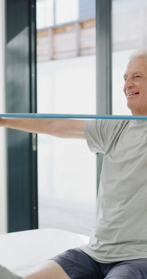 Physiotherapist, exercise or old man with resistance band, support or thumbs up Stock Footage 335112604