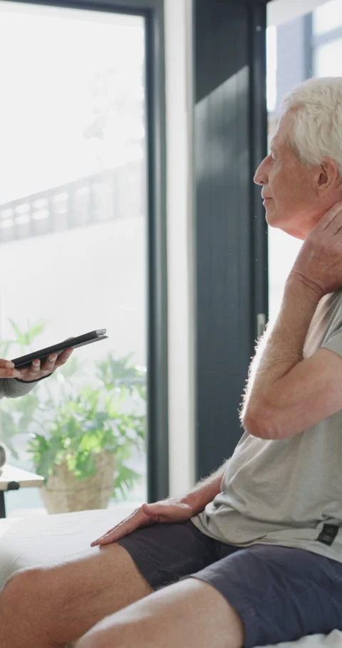 Physiotherapist, tablet and old man in clinic with neck pain, osteoporosis or Stock Footage 334922053
