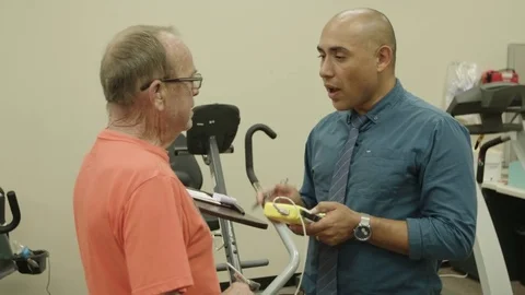 Physiotherapist talking to a patient Stock Footage 83187986