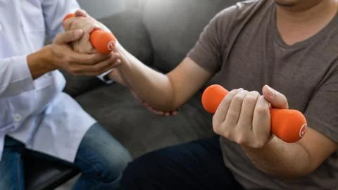 Physiotherapist working with patient doing with exercise, physical therapy co 스톡 사진