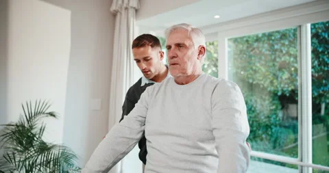 Physiotherapy, exercise and senior man with dumbbells, physiotherapist and Stock Footage 341406975