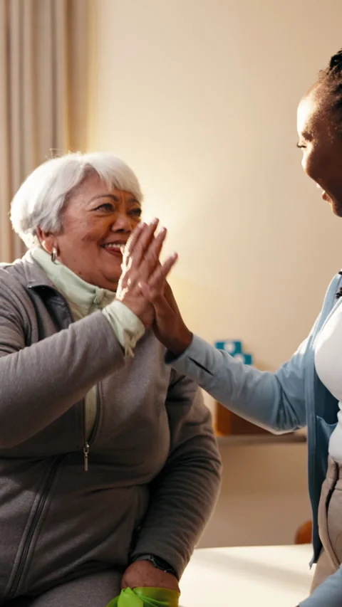 Physiotherapy, high five and senior woman for consulting, mobility progress and Stock Footage 341385987