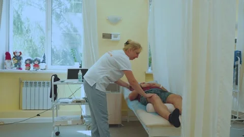 Physiotherapy, physiotherapist, physiotherapy procedure Stock Footage 314312579