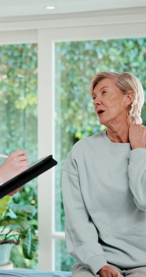 Physiotherapy, tablet and neck pain of mature woman for consultation, online Stock Footage 341469637