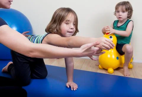 Physiotherapy with two children Stock Photos