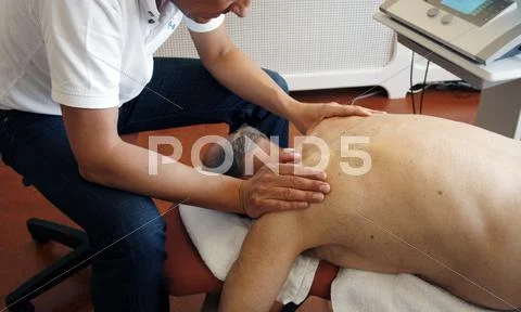 Physiotherapy by working on muscles Stock Photos