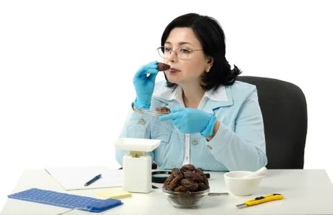 Phytosanitary engineer smelling dates Foto stock