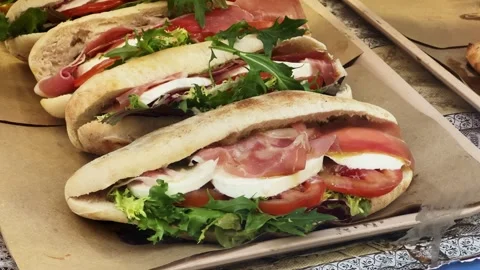 Piadina Italian Flatbread with jamon, lettuce, tomato and cheese. Stock Footage 271366476