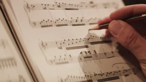 A pianist making notes on the paper Stock Footage 264551040