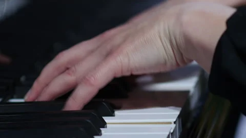 Pianist performing in orchestra. Close up hands of pianist playing.  Stock Footage 277826565