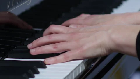 Pianist performing in orchestra. Close up hands of pianist playing.  Stock Footage 277826813