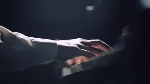 The pianist performs playing a grand piano. Hands close up Stock Footage