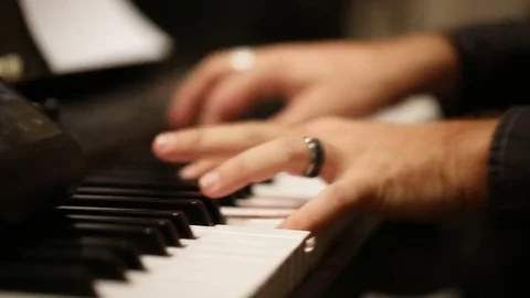 Pianist playing on keyboard Stock Footage 77279486