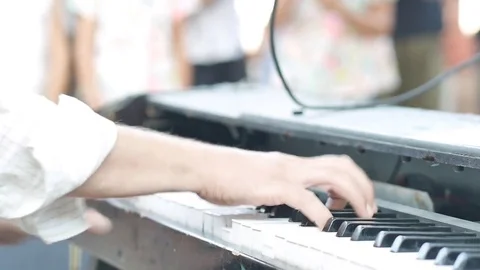 Pianist playing keyboard Stock Footage 79356981