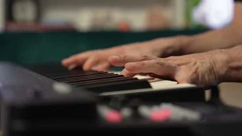 Pianist playing a keyboard Stock Footage 147692994