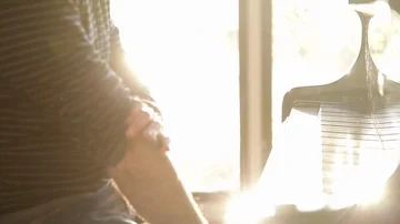 Pianist plays at sunset Stock Footage 85884006