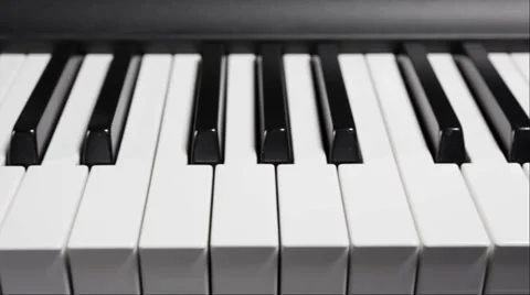 Piano angle shiny moving across keys sideways Stock Footage 36738003