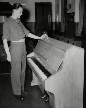 The Piano Installed By The Naafi In Knightsbridge Which Will Not Burn When A Cig Stock Photos