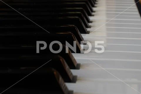 Piano keyboard background. Piano keys side view ~ Premium Photo #141709404