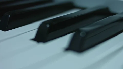 Piano keyboard background with selective focus. Warm color toned image Stock Footage 106873153