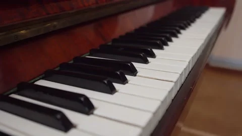 Piano keys are shown close-up. Stringed percussion keyboard musical instrument. Stock Footage 151098545