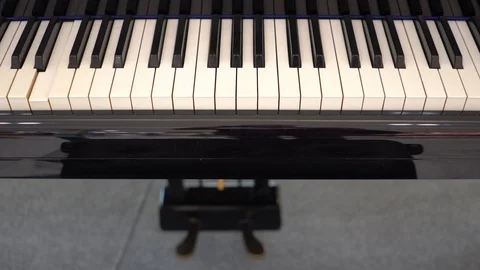 Piano with keys is playing alone, without the musician Stock Footage 119434457
