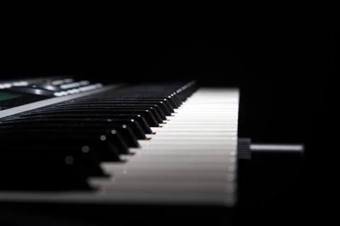 Piano keys in shadow Stock Photos