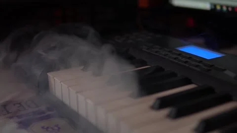 Piano keys in smoke Stock Footage 212164060