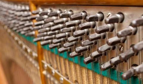 A piano with many strings and keys Stock Photos