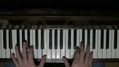 Piano overhead man playing slow zoom in Stock Footage 86882185