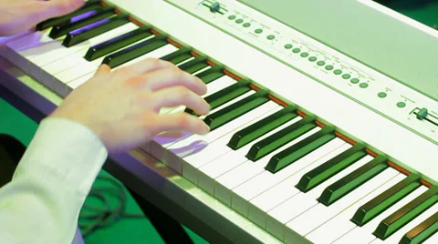 Piano player in jazz band performing on stage at holiday concert HD Stock Footage