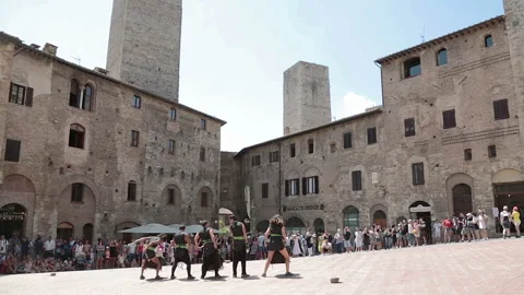 Piazza della cisterna, a group of musicians Stock Footage 131370082