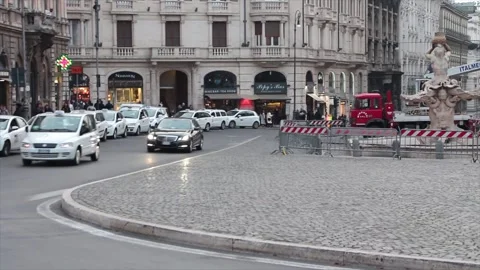 Piazza di barberini pan right to left with traffic cars vehicles during day rome Stock Footage 252147680