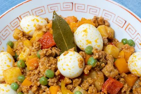 Picadillo with boiled quail eggs Stock Photos