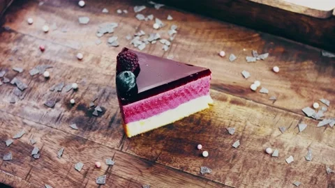 Picasso effect of Berry breeze cake on a wooden tray with decorations Stock Footage 231909008