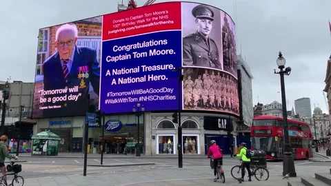 Piccadilly Circus lights up for Captain Tom Moore Stock Footage 148561113