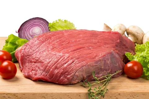 Pice of fresh raw meat with vegetables Stock Photos