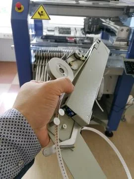 Pick and place feeder for automatic electronic components assembly Stock Photos