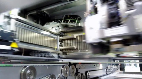 Pick and place machine installs SMD details on motherboard Stock Footage 256927534