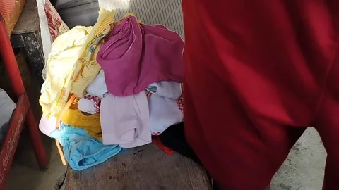 Pick up dry clothes Stock Footage 218217189