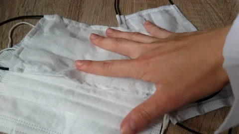 Pick up mask on the table. Stock Footage 130400832