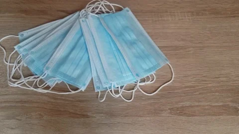 Pick up mask on the table. Stock Footage 136957557