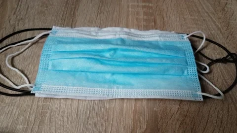 Pick up masks on the table Stockbeeldmateriaal 130400996