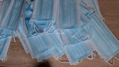 Pick up masks on the table. Video stock 156104084