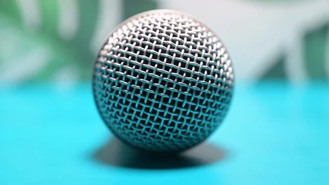 Pick up microphone on abstract background Stock Footage 128989448