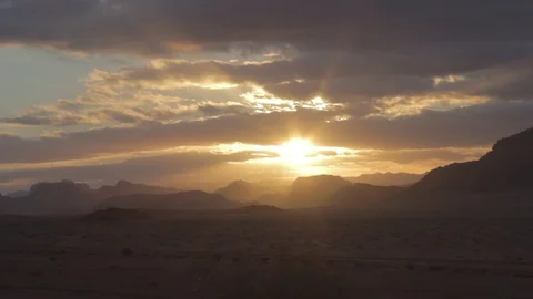 Pick-up is passing through the Wadi Rum desert at the sunset Stock Footage 127909993