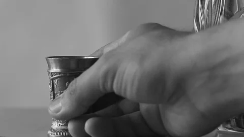 Pick up a pewter glass from the table Stock Footage 98038912