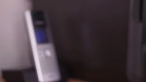 Pick up the phone to make a call slow motion Stock Footage 83058587