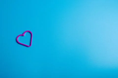 Pick plastic cookie cutter for making cookies in the shape of a heart on a bl Stock Photos